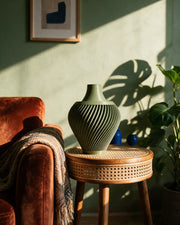 Spiral Urn Vase – on a side table at golden hour