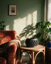 Swirl Slot Orchid Planter – on a side table at golden hour