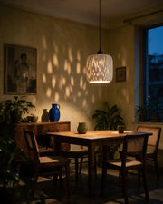 Teardrop Slot Pendant Light – at night on a bedside table