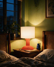 Twist Flare Table Lamp – at night on a bedside table