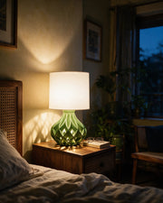 Twist Lattice Table Lamp – at night on a bedside table