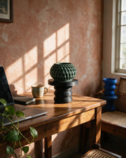 Twist Pedestal Display Stand – on a work desk in morning sun