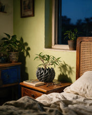 Twisted Flame Planter – at night on a bedside table