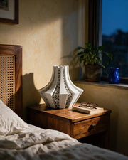 Voronoi Panel Vase – at night on a bedside table