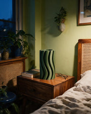 Wave Fin Vase – at night on a bedside table