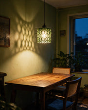 Wave Lattice Pendant Light – at night on a bedside table