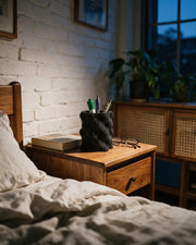 Wave Rib Pen Cup – at night on a bedside table