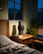 Wave Slab Fin Vase – at night on a bedside table