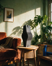 Wave Slab Fin Vase – on a side table at golden hour