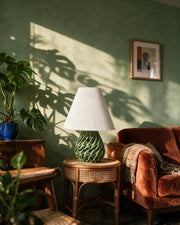 Web Base Table Lamp – on a side table at golden hour