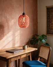 Web Capsule Pendant Light – on a work desk in morning sun