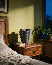 Wing Fold Vase – at night on a bedside table