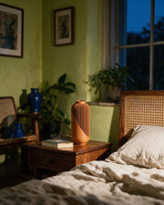 Wrap Rib Vase – at night on a bedside table