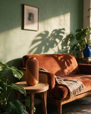 Wrap Rib Vase – on a side table at golden hour