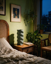 Zigzag Column Vase – at night on a bedside table