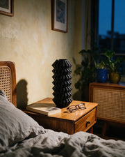 Zigzag Pleat Vase – at night on a bedside table