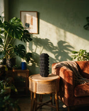 Zigzag Pleat Vase – on a side table at golden hour